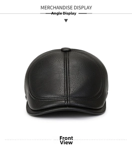 Front view of black textured leather ivy cap with ear flaps and top button detail