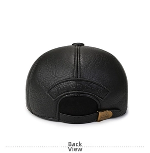 Detail of black faux leather baseball cap with bronze metal buckle and embossed logo
