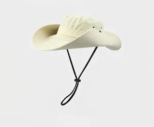 Detailed view of beige wide-brim sun hat with adjustable wind cord and side vent holes