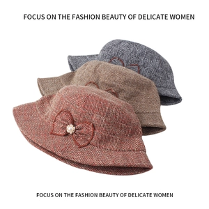 Three elegant wool tweed bucket hats with pearl bows in reddish brown, tan and grey blue