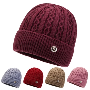 Detail of warm cable knit winter hats for elderly women in five assorted colors