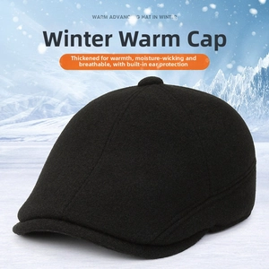 Detail of warm black wool flat cap with foldaway ear flaps and thermal lining