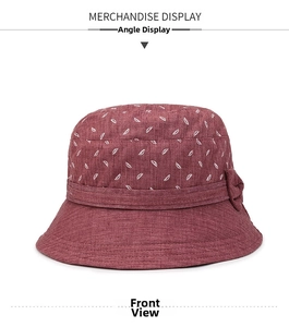 Détail du chapeau de soleil bordeaux pour femmes avec motifs feuilles et nœud