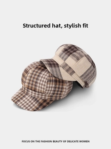 Close-up of vintage plaid newsboy caps showing thick wool blend texture and retro patterns