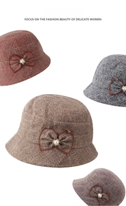 Detail view of tweed bucket hats in four colors with decorative bow and pearl button