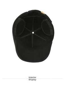 Interior view of winter duckbill cap showing felt lining and reinforced stitching details