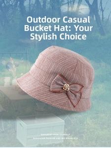 Close-up of brown twill bucket hat with triple-layered bow and golden floral crystal