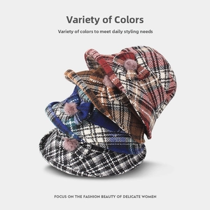 Collection of plaid wool bucket hats with bow and fur pompom detail in four classic colors