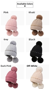 Various colors of knit beanies with faux fur pom-poms and rhinestone trim details