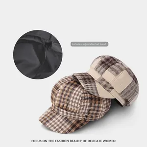 Detail of checkered newsboy cap showing adjustable interior drawstring for custom fit
