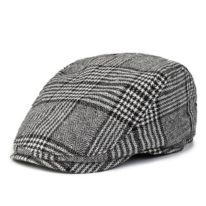 Classic black and white checkered newsboy cap for men in vintage British flat hat style
