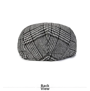 Detail view of the houndstooth pattern and back structure of a classic British newsboy cap