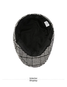 Detail of checkered flat cap interior showing size 60 tag and cotton blend material