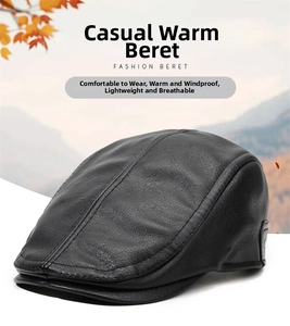 Detail of black faux leather beret featuring lychee texture and fine stitching