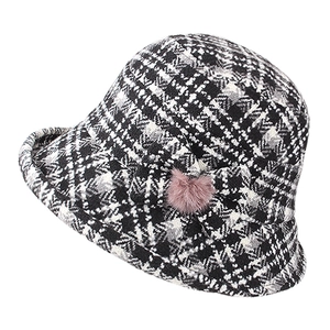 Women's houndstooth wool bucket hat with pink fur ball accent for winter warmth