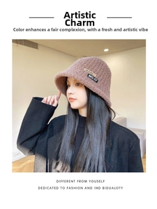 Detail of coffee brown plush bucket hat featuring vintage patch embroidery and soft texture