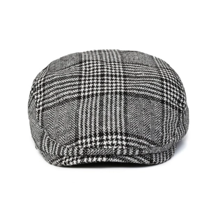 Classic British style houndstooth flat cap for men with stylish black and white plaid
