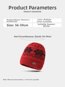 Detail of red winter knit hat with black floral pattern and 56-59cm elastic fit info