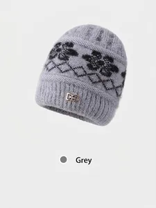 Grey winter knit beanie for women with jacquard pattern and golden flower buckle