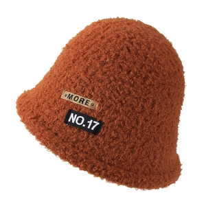 Caramel fleece bucket hat for women with More and No.17 patches on white background