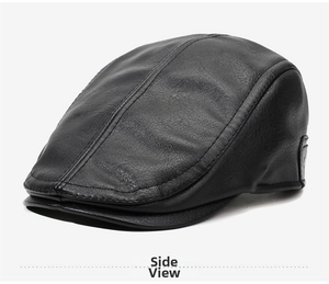 Detailed side view of black leather flat cap showing stitching and small decorative emblem