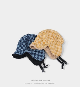 Winter plaid trapper hat with warm fleece lining and adjustable chin strap in navy and yellow