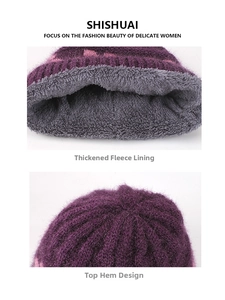 Detail of the thick gray fleece lining and top stitching on the purple knit beanie
