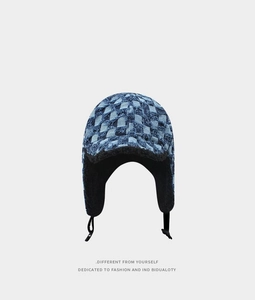 Detailed view of denim checkerboard aviator hat with soft black fleece lining