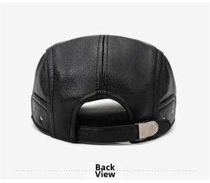 Detail of adjustable leather strap and metal buckle on the back of a black flat cap