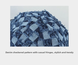 Close-up of blue checkerboard denim pilot hat with distressed frayed edges and texture