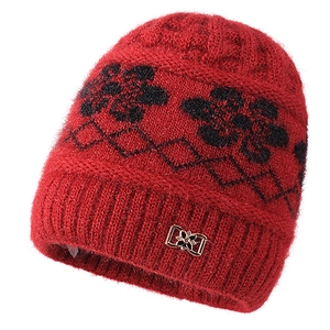 Red knit winter beanie for women with black floral jacquard pattern and fleece lining