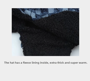 Close-up of thick black faux shearling lining on the checkered aviator trapper hat