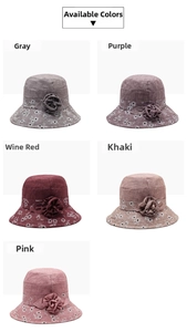 Detail view of elderly women's bucket hats in five floral colors with fabric flower decor