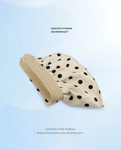 Foldable polka dot sun visor hat for women showing portable canvas and straw texture