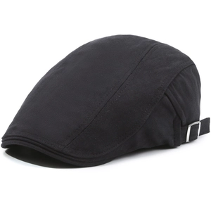 Detail showing the herringbone texture and silver metal adjustment buckle on the black cap