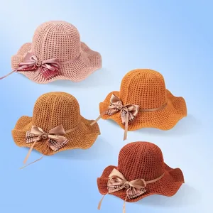 Breathable knit sun hat with wavy brim and ribbon bow for summer protection