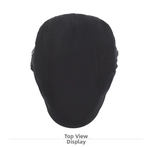 Top view of a black cotton newsboy cap showing detailed multi-panel stitching and structure