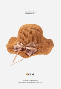 Detail of khaki breathable knitted sun hat with bowknot and rhinestone ring decoration