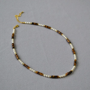 Tiger eye and pearl beaded necklace with gold metal accents and adjustable chain