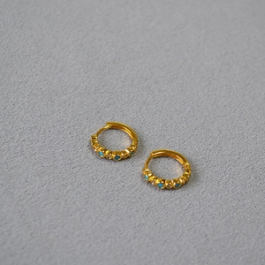 Gold plated brass hoop earrings with turquoise and white zircon stones in 45-degree view