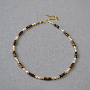 Retro tiger eye stone and pearl beaded necklace with gold accents and extension chain