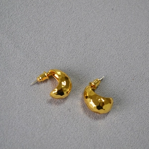 Vintage hammered texture gold crescent moon stud earrings with irregular reflective finish