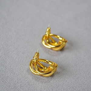 Minimalist multi-layer gold-plated hollow hoop earrings with a twisted metal design