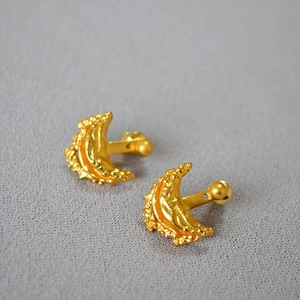 Textured gold moon-shaped brass earrings with a vintage irregular hammered finish