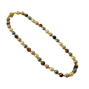 Retro beaded necklace featuring tiger eye stones, pearls, and gold magnetic clasp closure