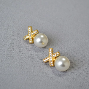 Elegant gold X-cross earrings with sparkling zircon inlay and large white round pearls