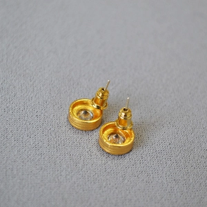 Textured 18K gold-plated stud earrings with center zircon and brushed metal finish