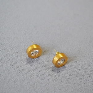 Vintage textured golden stud earrings with brilliant round cubic zirconia stones