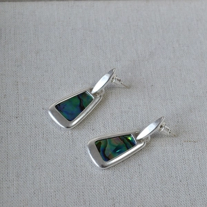 Detailed close-up of 925 silver earrings featuring trapezoid colorful abalone shell inlays