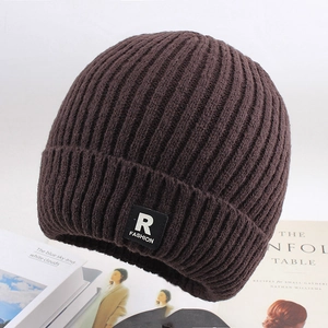 Detailed knit texture of dark brown winter beanie with stylish R FASHION square patch